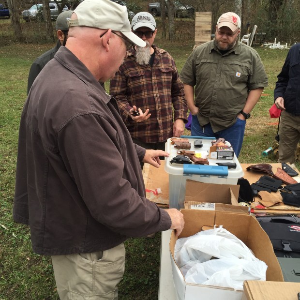 Tom Givens showing collection of revolver gear.
